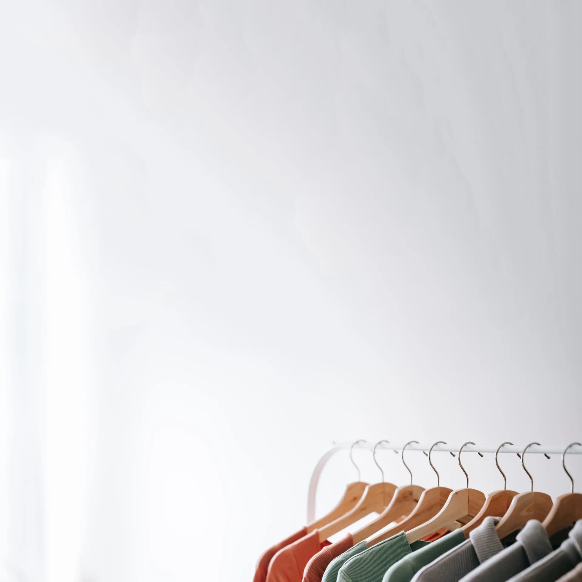 Grey Stone International A photo of clothes on hangers
